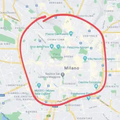En karta över Milano med en röd cirkel som markerar stadens centrum, perfekt för din **milano reseguide**.