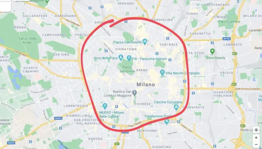 En karta över Milano med en röd cirkel som markerar stadens centrum, perfekt för din **milano reseguide**.